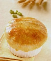 Fava beans soup in puff pastry crust